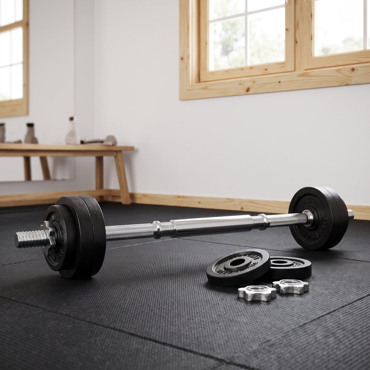 Skivstång med gjutjärnsskivor och extra vikter på en gummimatta i ett svenskt garagegym